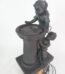 Playful children garden water feature statue with stone-effect finish and LED lights in Lagos, Nigeria