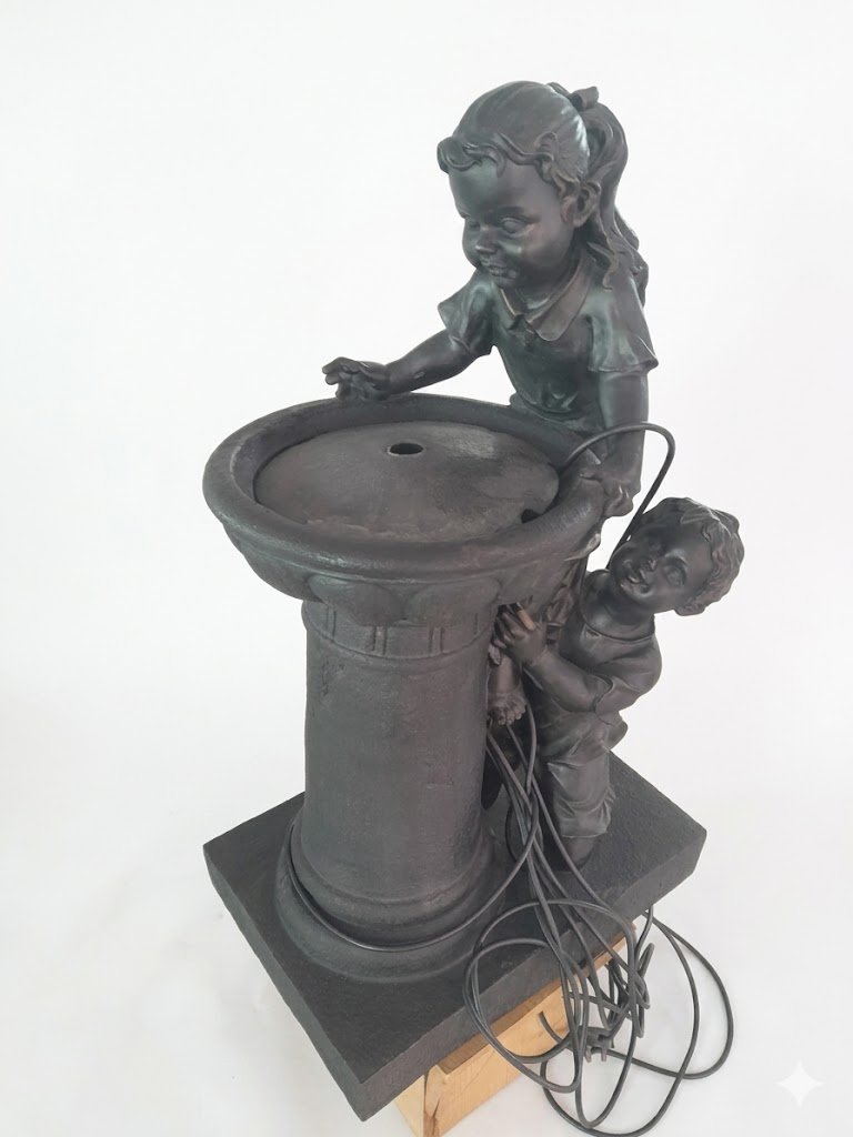 Playful children garden water feature statue with stone-effect finish and LED lights in Lagos, Nigeria