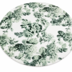 Vibrant green round placemat with a floral cutout design for elegant dining table decor in Lagos, Nigeria.