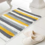Soft ochre and white striped cotton bath mat for bathroom floor décor in Lagos, Nigeria
