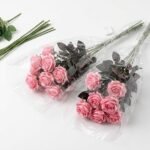 Vibrant hot pink and black mini water lily artificial flower bouquet for elegant home decor in Lagos, Nigeria.