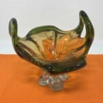 Handcrafted green, orange, and white glass planter for luxury indoor plant display in Lagos, Nigeria