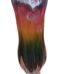 Tall hand-blown glass vase with a green and pink ombre gradient and ruffled rim in Lagos, Nigeria.