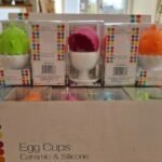 Egg cup holder with silicone lid for soft-boiled eggs, covered breakfast serving cup for kitchen use in Lagos
