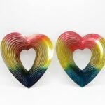 Two 3D multicolor heart wind spinners in red, yellow, and blue for hanging room decoration in Lagos, Nigeria