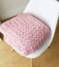 Pink knit throw blanket with soft fabric for sofa and bedroom décor in Lagos, Nigeria