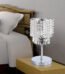 Small crystal table lamp glowing on bedside table for home décor in Lagos, Nigeria bedroom