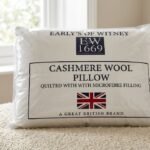White Early's of Witney quilted cashmere wool pillow with Union Jack logo in Lagos, Nigeria.