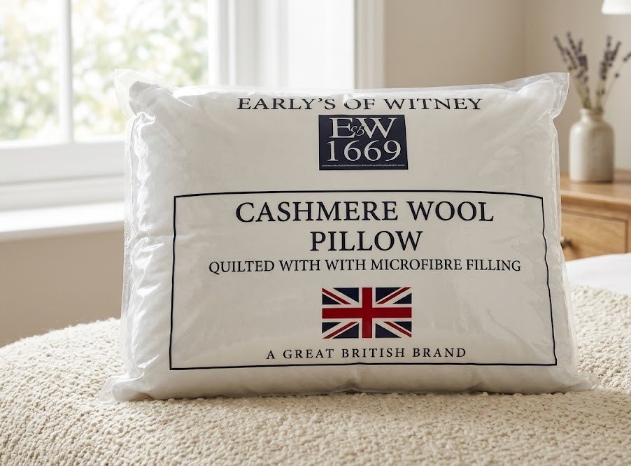 White Early's of Witney quilted cashmere wool pillow with Union Jack logo in Lagos, Nigeria.