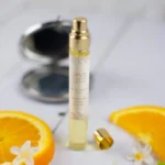 Slim glass 10ml bottle of Love Eau De Parfum with gold cap in Lagos, Nigeria