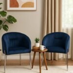 Dark blue rouch velvet accent chair with a curved back and sleek chrome legs for home décor in Lagos, Nigeria