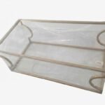 Clear tempered glass coffee table with curved chrome metal base for modern living room décor in Lagos Nigeria