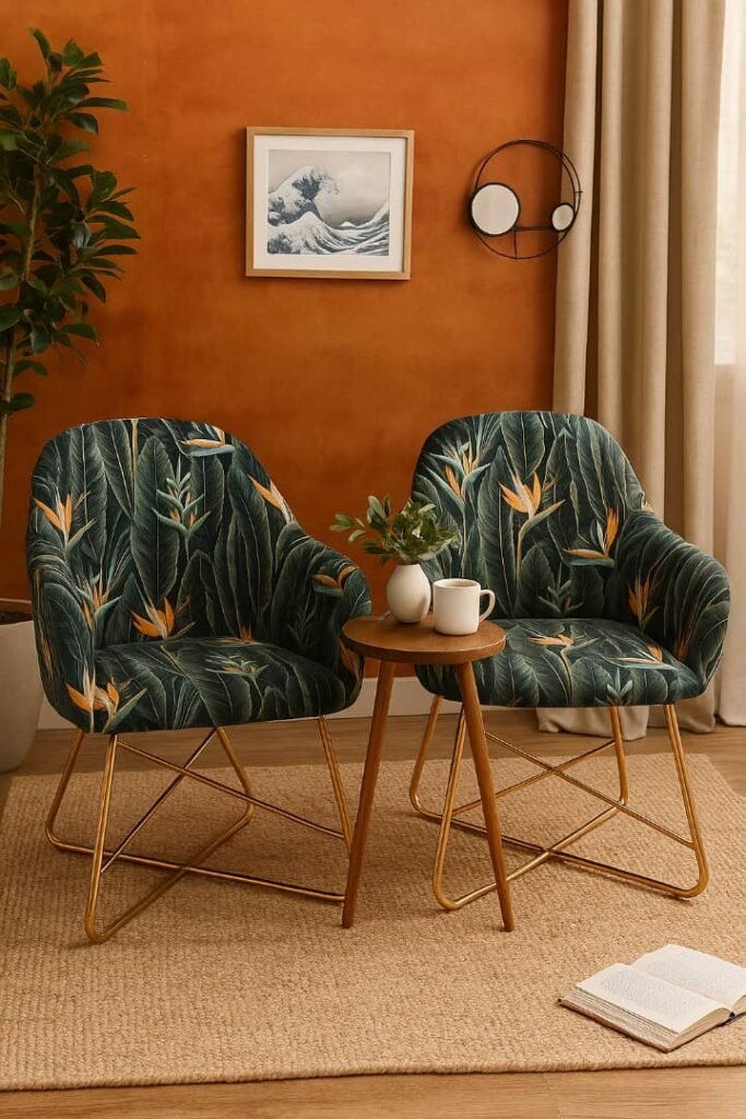Set of 2 dark green velvet armchairs with orange bird of paradise floral print and gold legs in Lagos, Nigeria