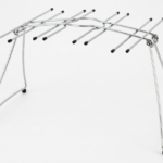 Sleek metallic under-shelf wine glass holder rack for home bar and kitchen organization in Lagos, Nigeria