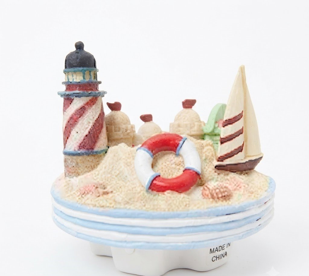 Handcrafted nautical candle jar topper with lighthouse, sailboat, and sand castle in Lagos, Nigeria