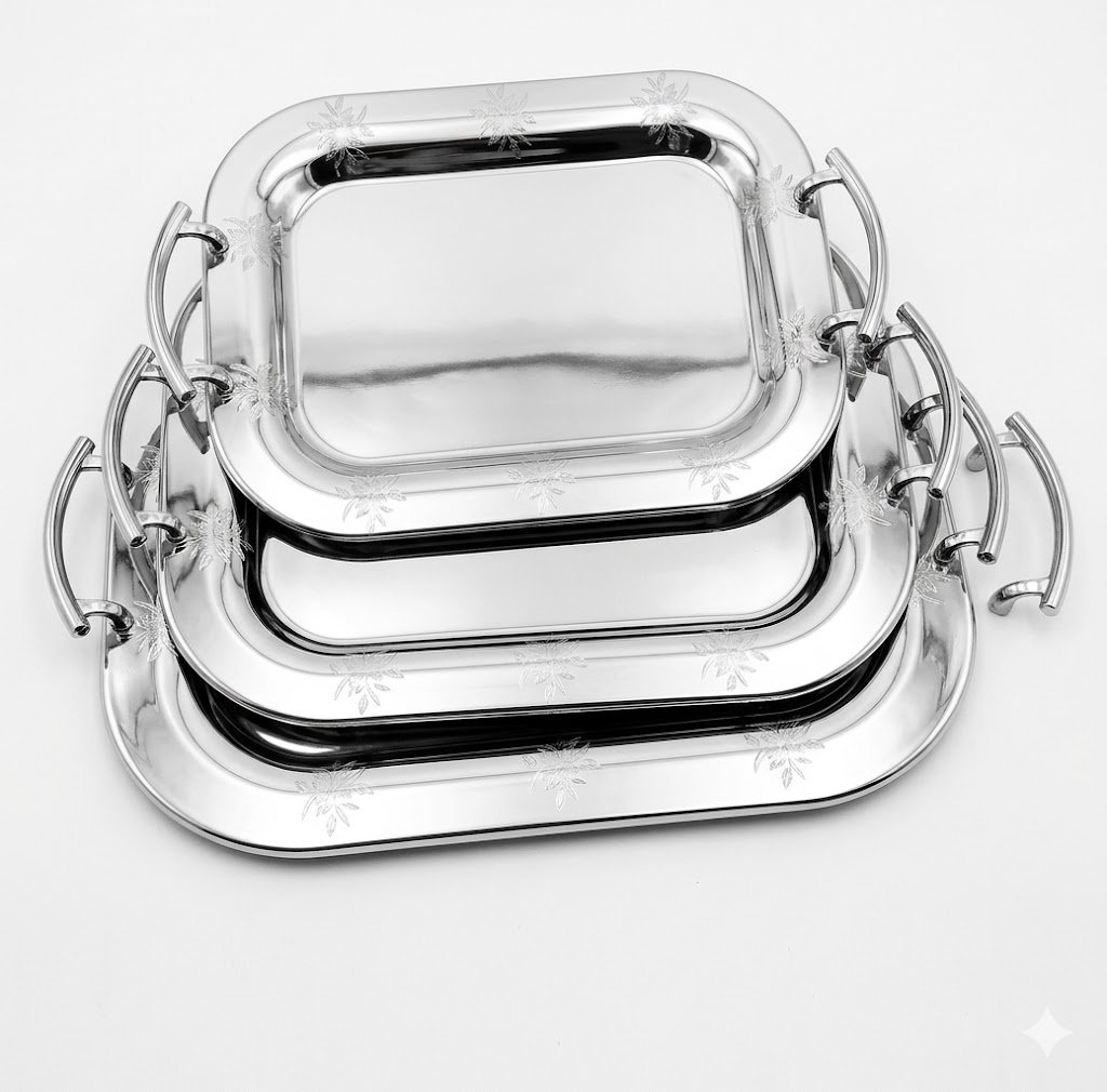 Three piece set of Loreno silver serving trays with polished metallic surfaces for hosting in Lagos, Nigeria