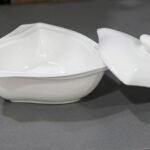White triangular ceramic soup bowl with a matching lid for elegant table service in Lagos, Nigeria