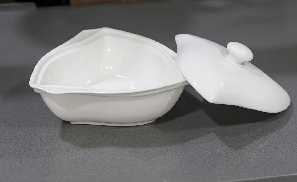 White triangular ceramic soup bowl with a matching lid for elegant table service in Lagos, Nigeria