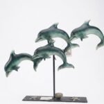 Silver Metallica dolphins decorative statue for luxury tabletop and living room styling in Lagos, Nigeria