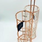 Rose gold wire free-standing toilet roll holder and storer for modern bathroom organization in Lagos, Nigeria