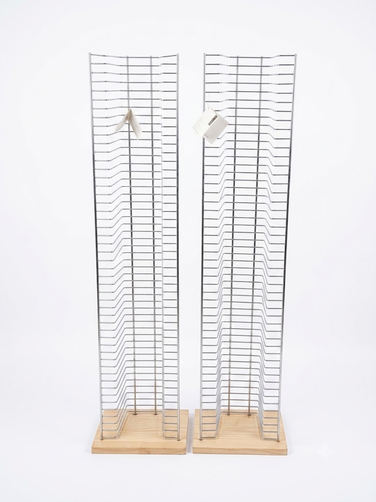 Sleek floorstanding DVD storage rack with a light wood base for home media organization in Lagos, Nigeria.