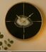 Modern Celina 37cm round wall clock with black glass face, gold trim, and central agate stone effect in Lagos, Nigeria