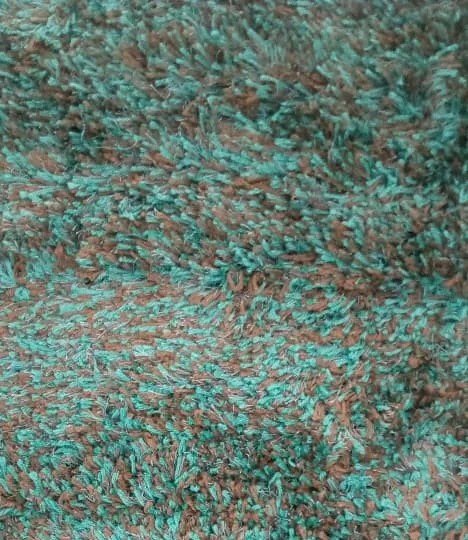 Soft brown and teal wool look rug with geometric patterns for living room floor decor in Lagos, Nigeria