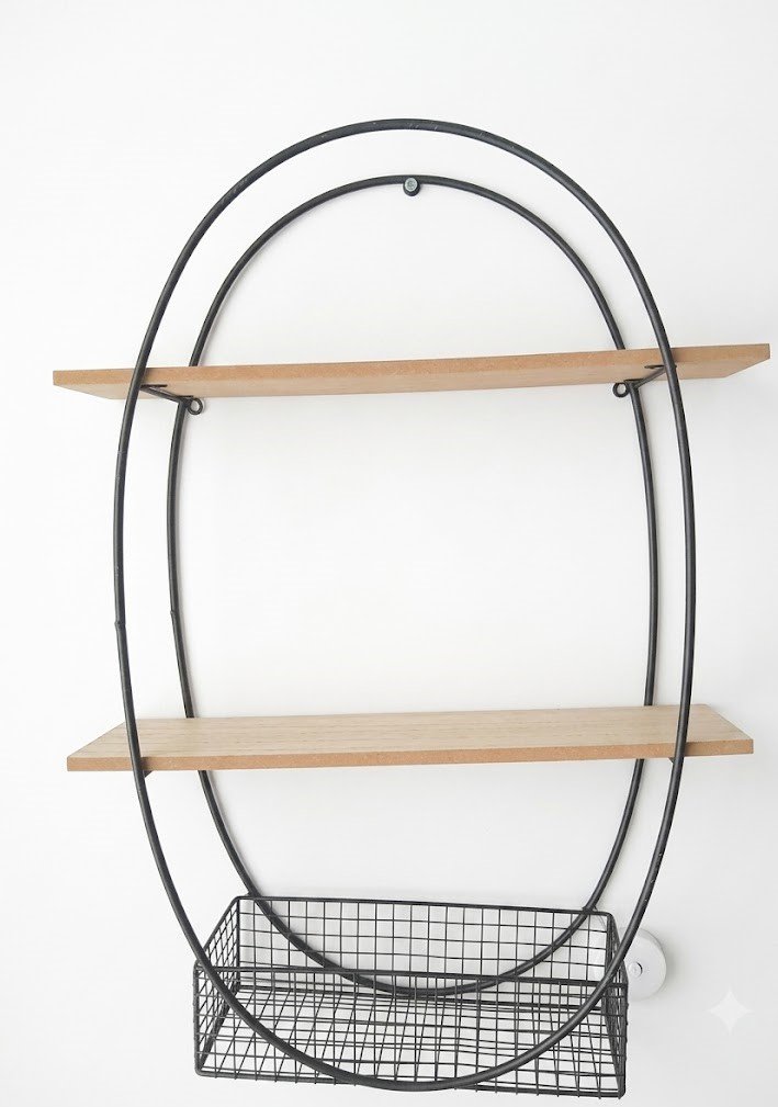Black oval metal wall shelf with two wooden platforms and a wire storage basket at the base, Lagos, Nigeria