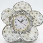 Silver floral-shaped tabletop clock with crystal and pearl-like embellishments for home decor in Lagos, Nigeria