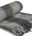 Charcoal grey and black check Frisco recycled cotton throw blanket with fringed edges for Lagos, Nigeria home décor.
