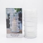 Modern clear glass cylinder hurricane vase with a decorative white metal spiral wire wrap for pillar candles in Lagos