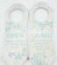 White vintage-style wooden door hanger with blue floral details and inspirational Open/Closed text in Lagos, Nigeria