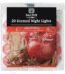 Apple cinnamon 8 hour scented candle in glass jar with warm spicy fragrance on table Lagos Nigeria