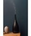 Thalia Dusk aroma diffuser black design with mist output and ambient light on table Lagos Nigeria