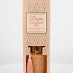 Rose gold diamond-textured glass Desire Pomegranate Noir reed diffuser with a matching tassel in gift box, Lagos, Nigeria