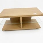 Sleek beech wood effect TV unit with a clear tempered glass shelf and minimalist open-back design, Lagos, Nigeria