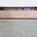 Wooden TV unit with storage shelves and modern design for living room setup in Lagos, Nigeria