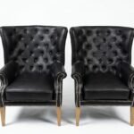 Sleek black two-seater upholstered loveseat for modern living room décor in Lagos, Nigeria