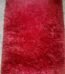 Soft shaggy red rug 4 by 6 feet for cozy bedroom and living room flooring in Lagos, Nigeria.