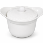 White round porcelain lidded casserole serving dish with wide handles for oven-to-table dining, Lagos, Nigeria
