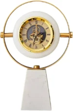 Modern VejiA desk clock with a white marble pedestal, gold circular frame, and visible skeleton movement in Lagos, Nigeria