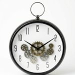 Black hanging wall clock with exposed silver moving gears and Arabic numerals for home decor in Lagos, Nigeria.