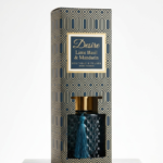 Teal diamond-textured glass Desire Lime Basil & Mandarin reed diffuser with a matching tassel and gold cap, Lagos, Nigeria