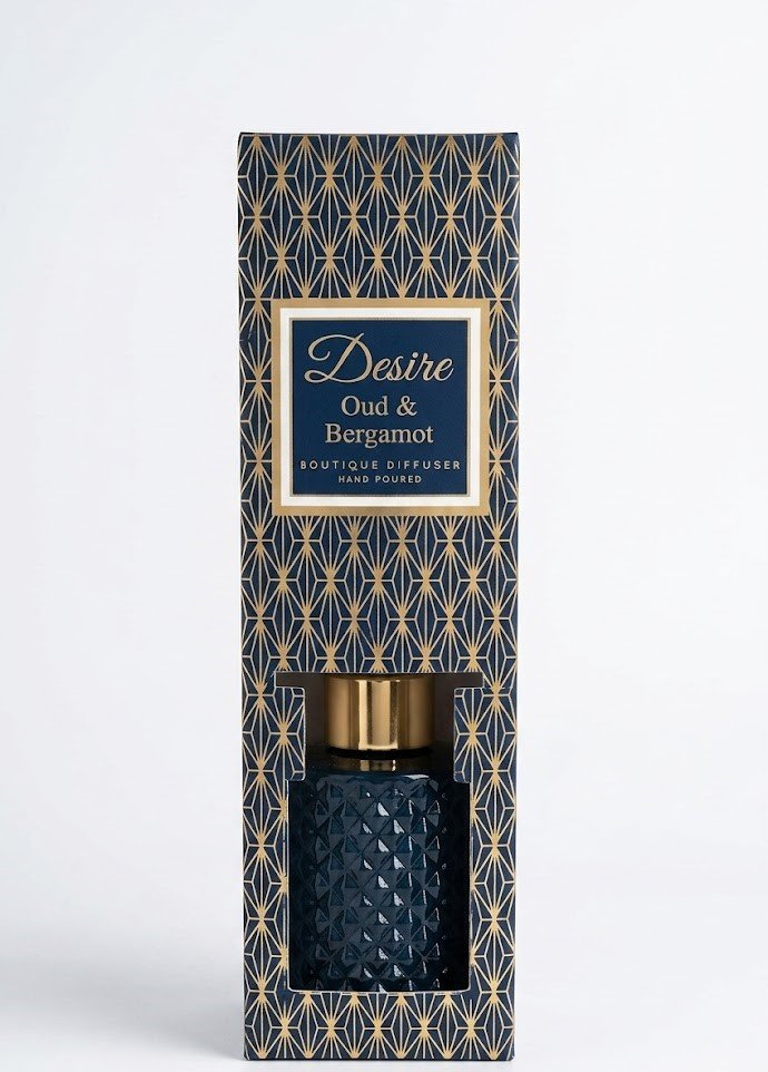 100ml Desire Oud and Bergamot reed diffuser in a luxury black diamond-cut glass bottle with silver cap in Lagos