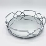 Silver round 21cm mirrored tray with an abstract Art Deco-style wire rim for displaying perfume and candles in Lagos