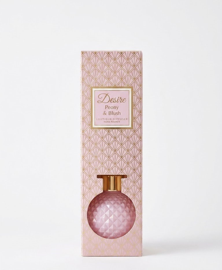 Desire 100ml Peony & Blush reed diffuser in a pink diamond-patterned round glass bottle with gold cap in Lagos, Nigeria