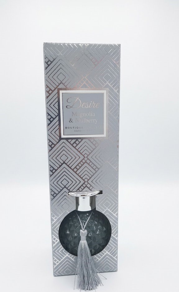 Desire 100ml Magnolia and Mulberry reed diffuser in a round pink diamond-textured glass bottle with gold cap in Lagos
