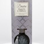 Textured charcoal grey glass Desire Magnolia & Mulberry boutique reed diffuser with silver tassel, Lagos, Nigeria