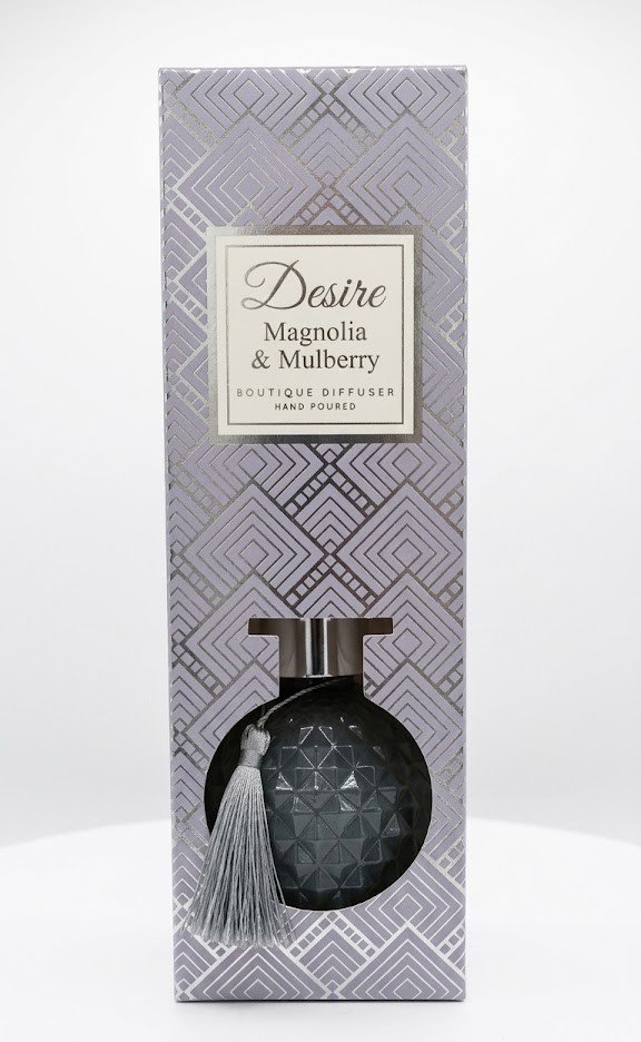 Textured charcoal grey glass Desire Magnolia & Mulberry boutique reed diffuser with silver tassel, Lagos, Nigeria