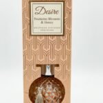 Rose gold round diamond-textured glass Desire Nectarine Blossom & Honey reed diffuser with tassel, Lagos, Nigeria
